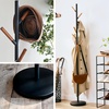 image:imageYAMAZAKI Home Freestanding Coat Rack Stand  Modern Coat Tree with Wooden Hooks Standing Coat Hanger for Entryway Sturdy Weighted Base Steel White Easy Assembly  Modern coat tree stand and standing coat hanger for entryways Durable steel construction Easy assembly Smart space saverBlack