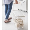 image:imageYamazaki Home Compact Rolling Laundry Cart Wire Hamper with Wheels White  Compact rolling laundry basket cart features a metal hamper with wheels and a handle for easy mobility Keeps items tidyWhite